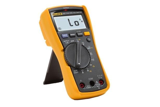 Fluke 117 yellow and black digital multimeter on its kickstand